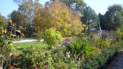 Cottage garden border in front of Oak Barn and The Granary