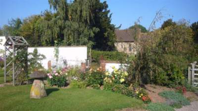 Garden view at Church House Farm with Milson Church in view