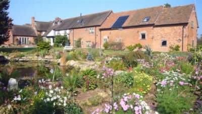 Rear of Oak Barn and The Granary cottages at Church House Farm Holiday Cottages